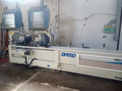 Troncatrice CNC doppia testa AUDATECH DH550 usata