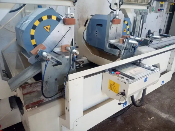 Troncatrice CNC doppia testa AUDATECH DH550 usata