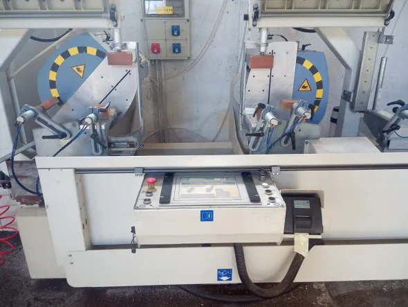 Troncatrice CNC doppia testa AUDATECH DH550 usata